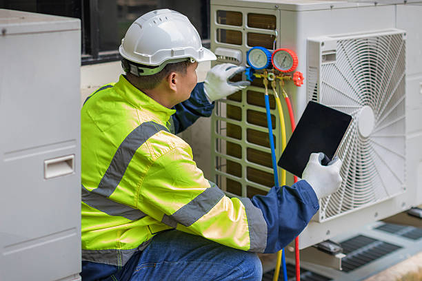 Professional Heat Pump Repair technician working in Fairfax, OH